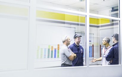 Business people and workers talking