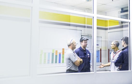 Business people and workers talking